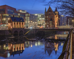 Fototapeta premium View from Holländischer Brook to Fleetschloesschen in Hamburg Speicherstadt