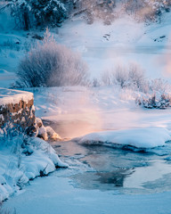 Icy winter sunset river