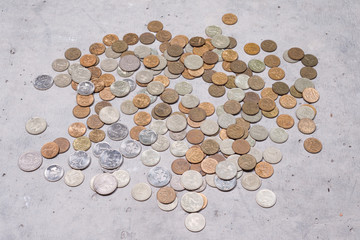 a scattering of Russian coins on the gray concrete floor