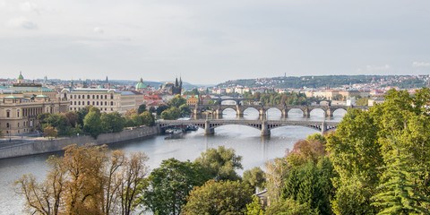 Obraz premium Panorama image of the Old Town pier architecture and Charles Bridge over Vltava river in Prague, Czech Republic