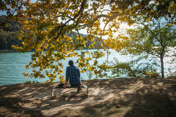 Handsome Man Sit by Lake © andrii_popovych
