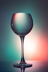 Glass of water on a colored background