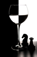 Glass of water with overlap in the form of a chessboard concept