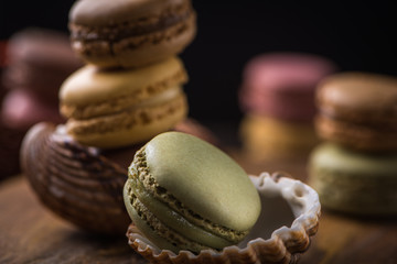 Column with cracked macaroons in sea shells