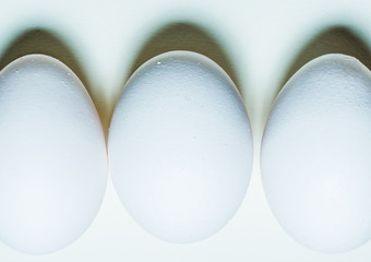 White Easter egg on a white background. Minimalistic greeting card