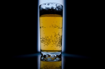 glass of beer on dark background,glass of cold beer on the table. object on a black background, а glass of beer, alcohol beverages, beer with foam  black background