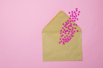 Craft envelope with pink paper hearts, valentines day