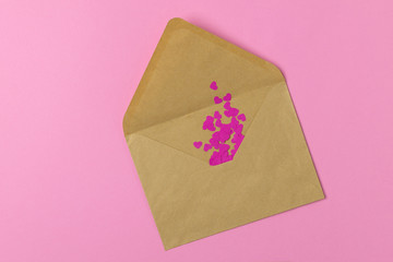 Craft envelope with pink paper hearts, valentines day