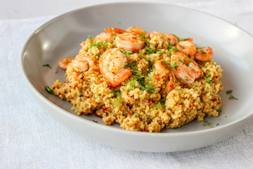 Grits cous cous with vegetables and grilled shrimp