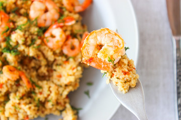 Grits cous cous with vegetables and grilled shrimp