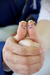 smileys on fingers with wedding rings