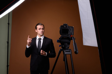 Portrait of young Caucasian businessman influencer vlogging