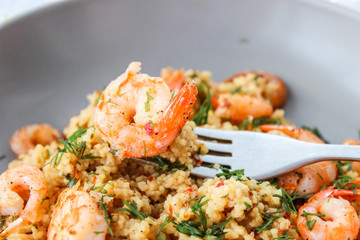 Grits cous cous with vegetables and grilled shrimp