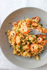 Grits cous cous with vegetables and grilled shrimp