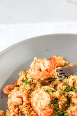 Grits cous cous with vegetables and grilled shrimp