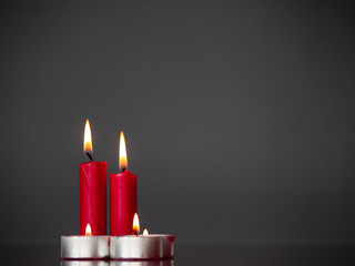Concept of love Red candles lit with a gray background