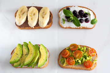 toasts with various fillings on a white background.