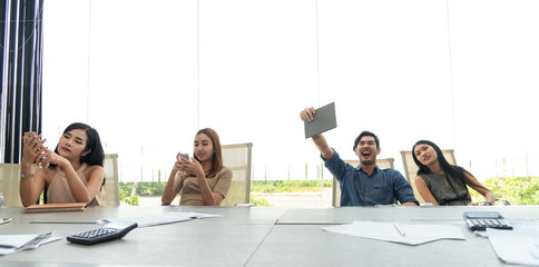 Fototapeta premium Teamwork business concept .Start up business people in modern office, working together having success. Multiethnic start-up business team on meeting in modern bright office interior brainstorming