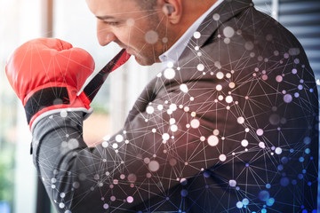 Close up of hands professional confident businessman standing with red boxing gloves .Tough competitive ready to fighting business and financial concept ,copy space