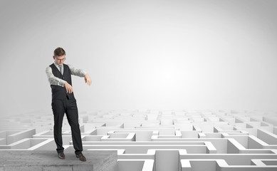 Zombi elegant businessman on the top of a labyrinth
