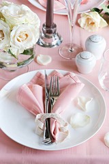 Festive table setting for Valentins Day, Easter, Mother's Day ore wedding. Elegant table decoration with fresh roses. 