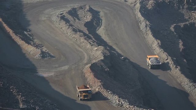 Iron ore mining. In a career go Belaz. Shooting drone.