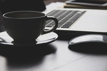 Office desk table with notebook, computer keyboard, mobile phone and other office supplies. Top view with copy space, flat lay. vintage background.