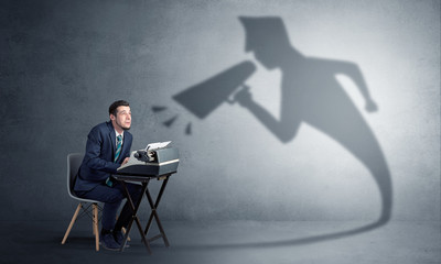 Hard working businessman shadow yelling to himself concept
