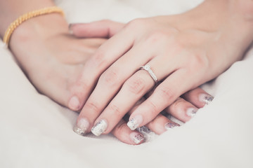 Hands of the bride