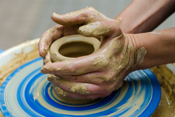 Potter at work. makes a jug out of clay. pottery workshop