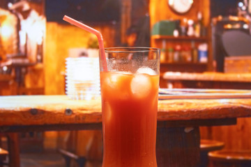 Bloody Mary cocktail in highball glass with ice and straw