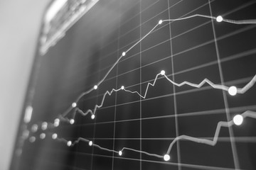 Stock exchange market in black and white on LED screen. Finance and economic concept.