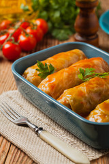 Traditional stuffed cabbage with minced meat and rice, served in a tomato sauce.