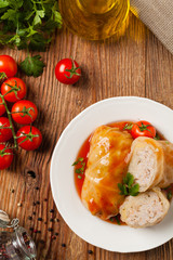 Traditional stuffed cabbage with minced meat and rice, served in a tomato sauce.