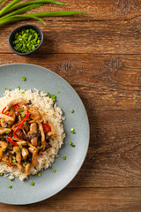 Pork chop with peppers, mushrooms and bamboo. Served with rice.