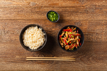 Pork chop with peppers, mushrooms and bamboo. Served with rice.