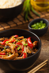 Pork chop with peppers, mushrooms and bamboo. Served with rice.