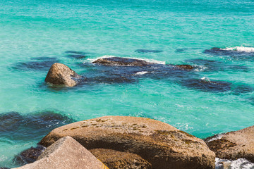 Turquoise ocean water and the rocks, natural background image