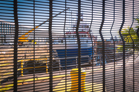 Ship In A Dry Dock Behind The Fence In Cape Town