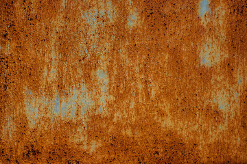 Texture of old rusty metal, painted white which became orange from rust. Horizontal texture of cracked paint on rusty steel