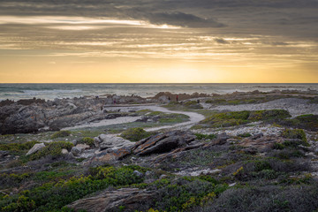 Beatiful sunset at Cape Agulhas, southernmost point of Africa