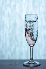 a splash in a glass of white wine and whiskey