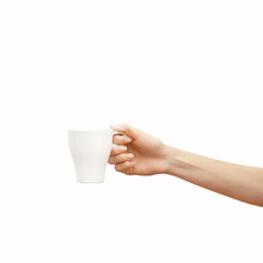 White cup in hand isolated on white background