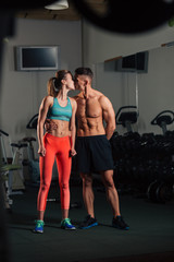 Young fit couple kissing after  a workout together