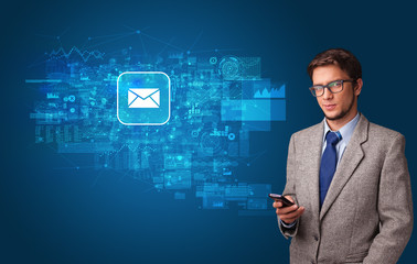 Young person using phone with mail and online communication concept
