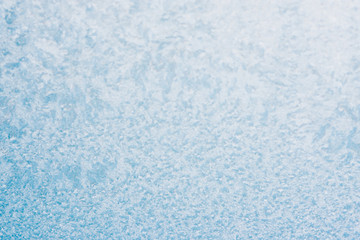 Frozen winter abstract background on the window glass with copy space