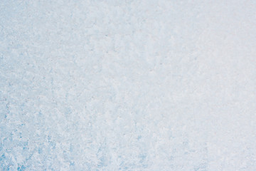 Frozen winter abstract background on the window glass with copy space