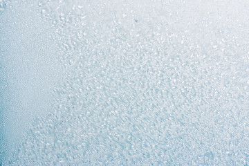 Frozen winter abstract background on the window glass with copy space