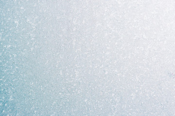 Frozen winter abstract background on the window glass with copy space
