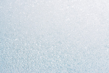 Obraz premium Frozen winter abstract background on the window glass with copy space